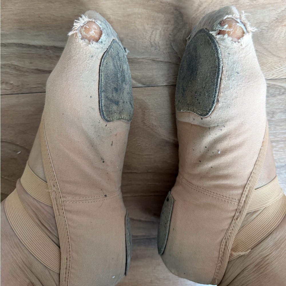 Very worn ballerina flat shoes